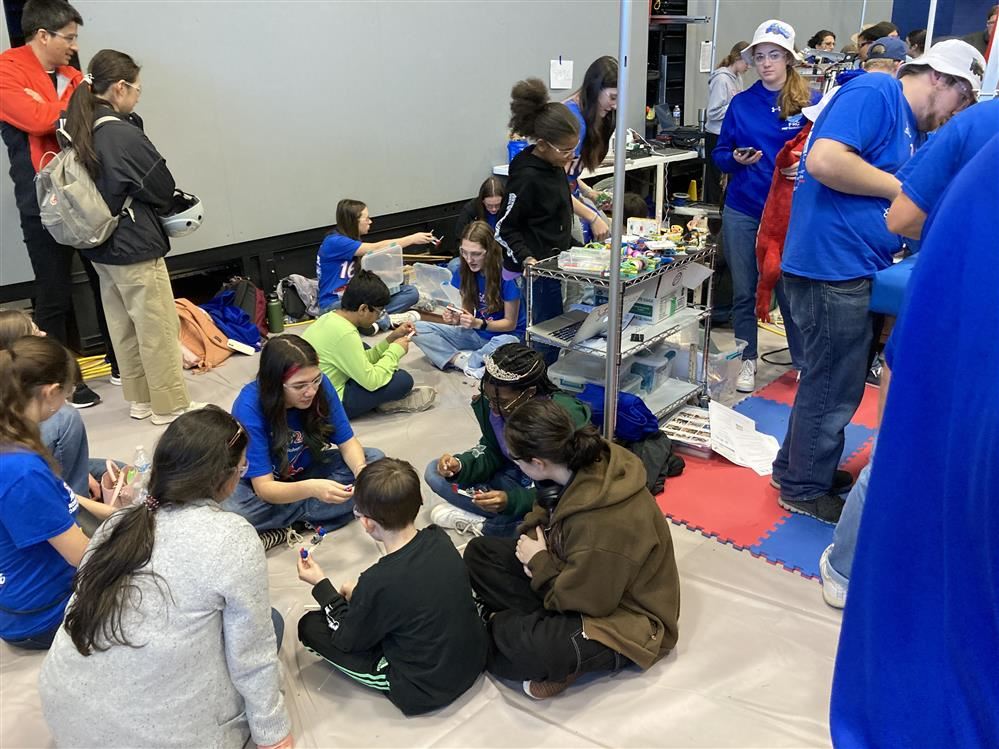  Members of GaCo 1629 robotics team demonstrate a waypoint lesson to other students.